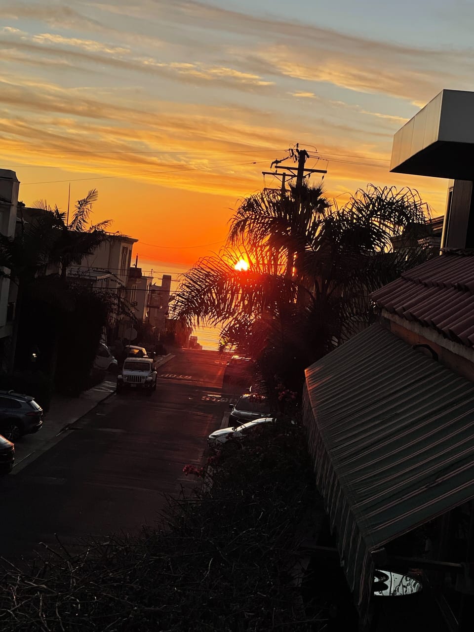 Sunset view down our street taken from 3rd floor deck.