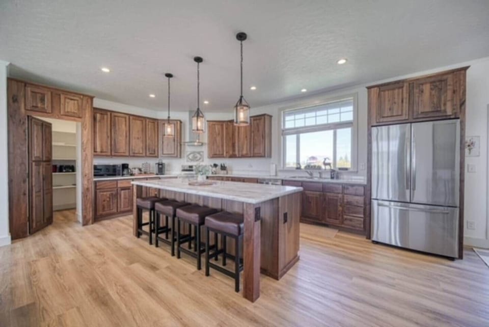 Hidden pantry, large area and long countertops and island for baking, entertaining, and meal prep