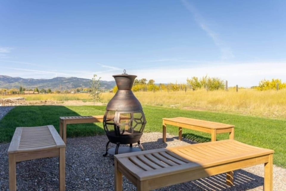Build a cozy fire and watch the bright night stars or sunsets from the beautiful back yard!

