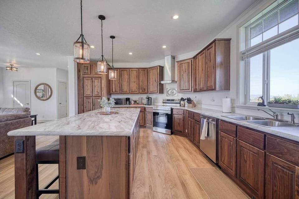 Homey and bright, with views and access to BBQ grill out the back door, lg groups love this space!