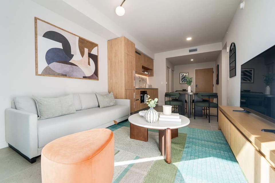 Stylish lounge with modern art and cozy seating.
