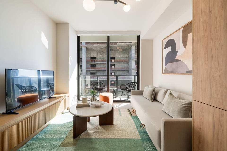 Open-concept living area with balcony access.
