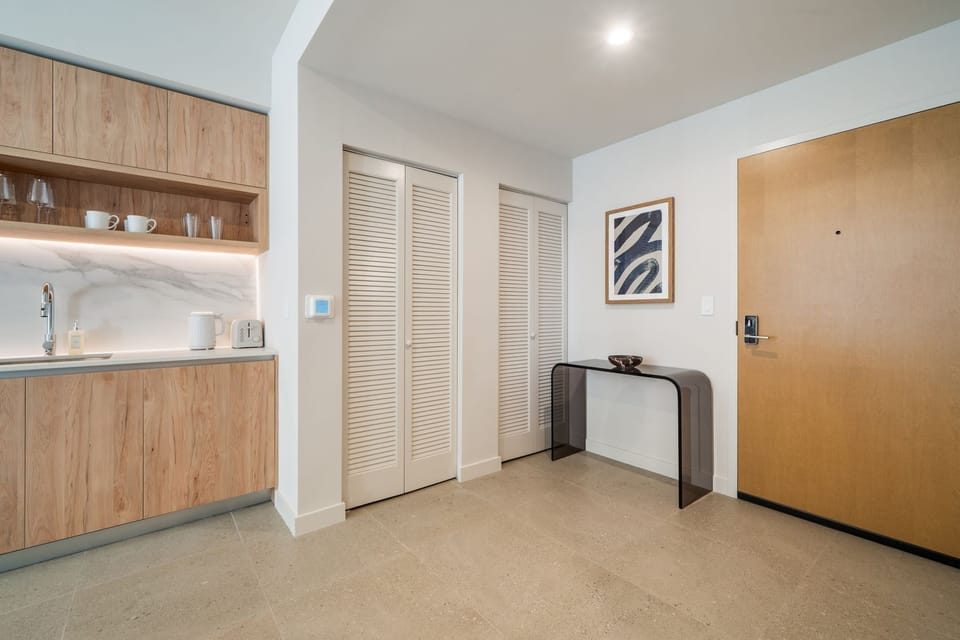 Clean entryway with ample storage space.