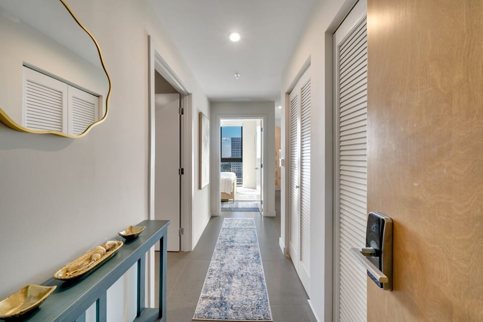 Clean, minimalist hallway leading to the bedrooms