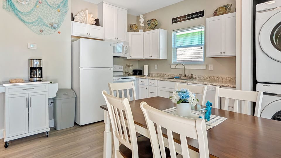 Bright kitchen, dining and living room perfect for gathering with family and friends. 
