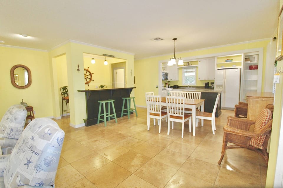 The open floorplan offers options of dining table and bar seating.