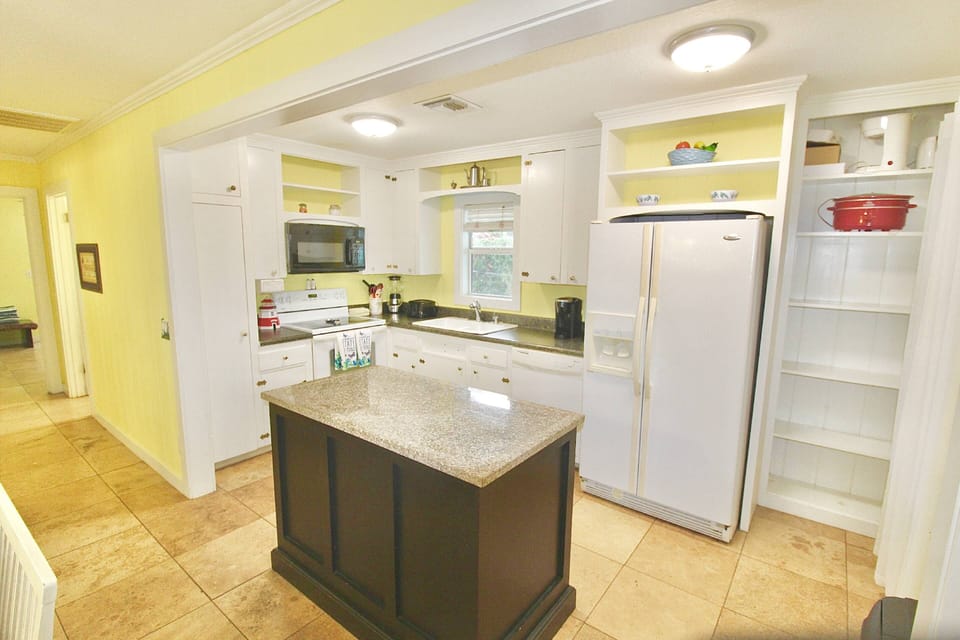 The cottage kitchen plenty of space to prep, cook and store all your vacation groceries.