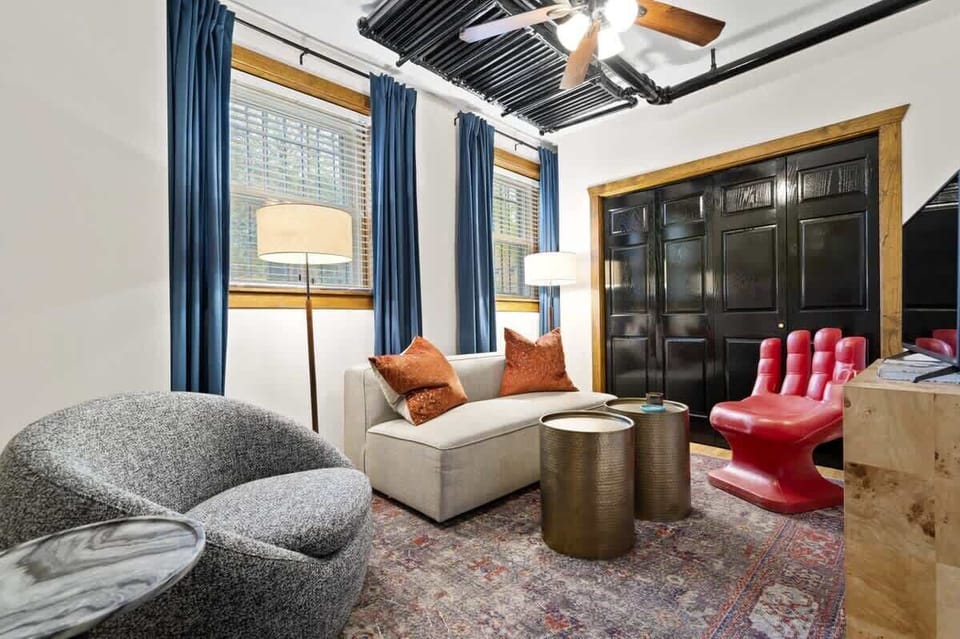 Take a seat — we promise the giant hand is exactly as comfortable as it looks.