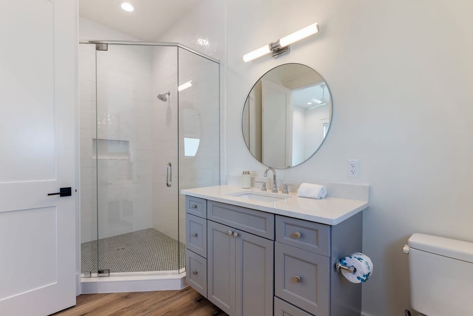 En suite bathroom features a walk-in shower.