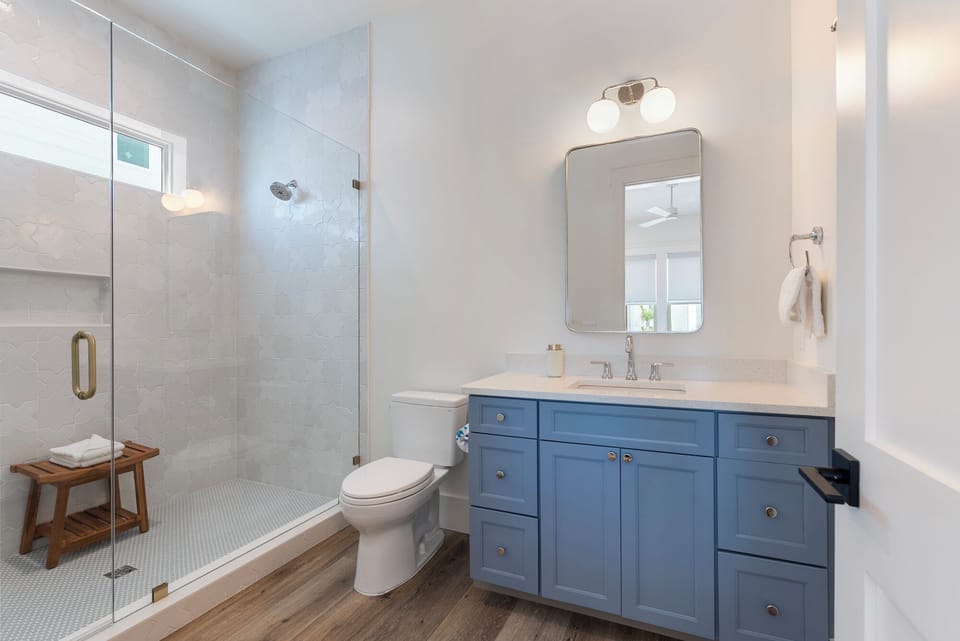 En suite bathroom off the second first-floor king bedroom with large walk-in shower