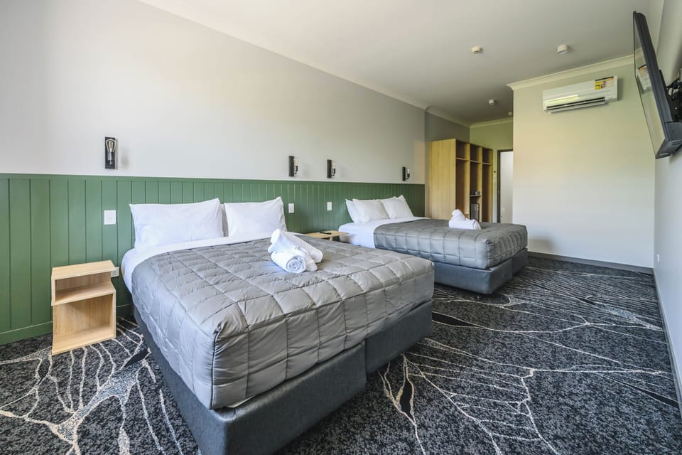 Family Quadruple Room, 2 Queen Beds, Balcony, City View | Iron/ironing board (on request), WiFi (free)