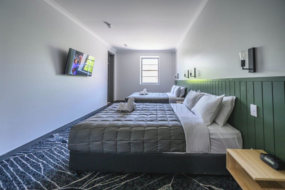 Family Quadruple Room, 2 Queen Beds, Balcony, City View | Iron/ironing board (on request), WiFi (free)