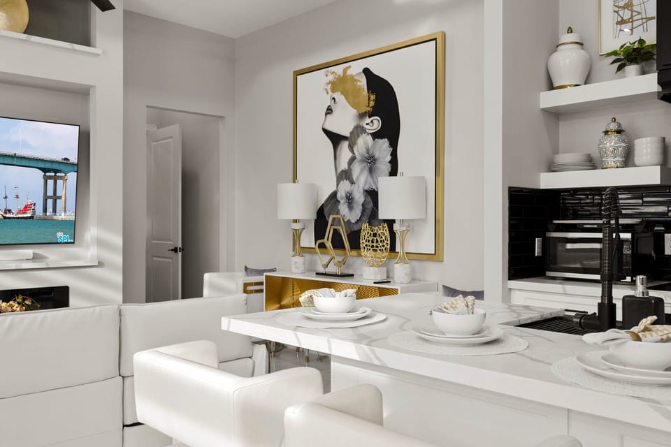 Sleek kitchen with breakfast bar seating, perfect for casual meals or morning coffee before the beach.