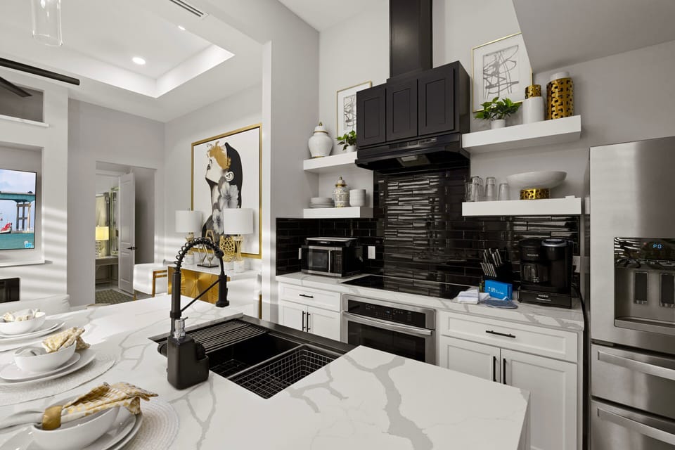 Fully equipped modern kitchen with spacious countertops and high-end finishes for easy meal prep.