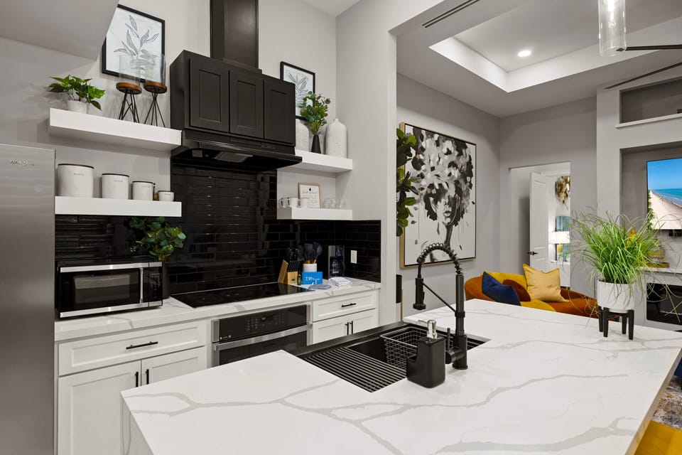 Fully equipped modern kitchen with spacious countertops and high-end finishes for easy meal prep.