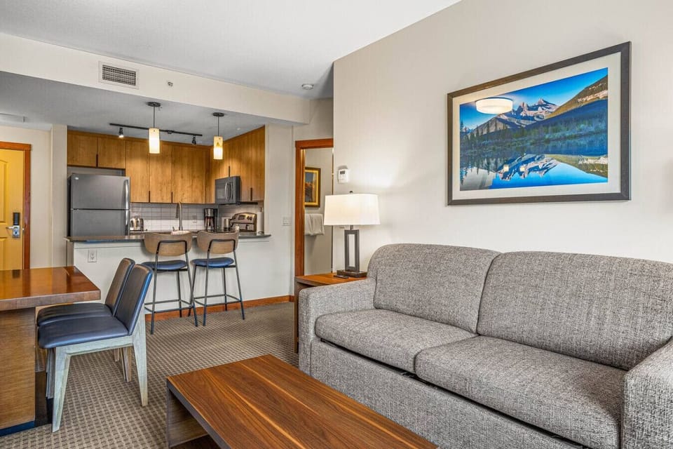 This living space featuring a cozy queen sofa bed, is thoughtfully designed for cherished quality time with loved ones.