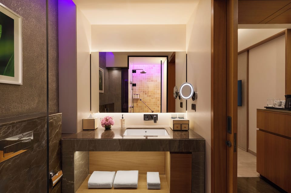Designer toiletries, hair dryer, bidet, towels
