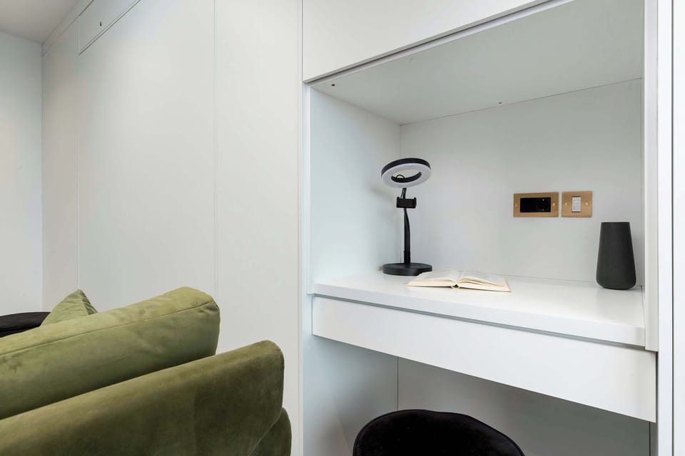 The living room's modern furnishings create a welcoming atmosphere.