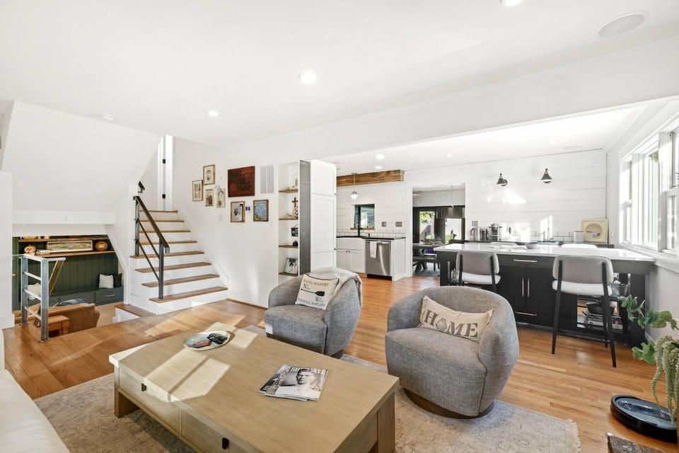 The open main level floor plan includes the Family Room, kitchen, eat-in kitchen bar (seating for 4) and expansive dining room.