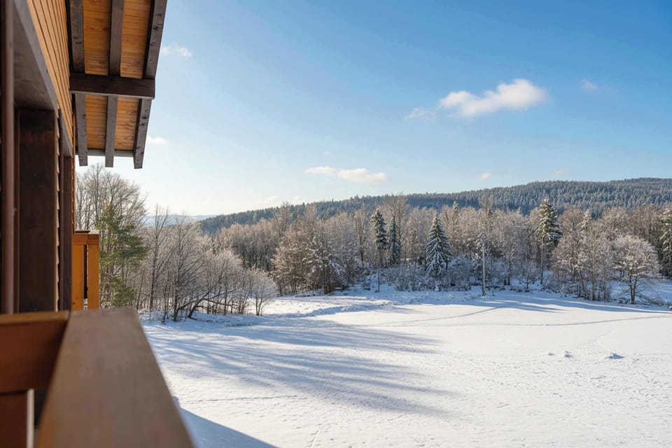 Peaceful winter scenery with snow-covered landscapes and mountain surroundings.