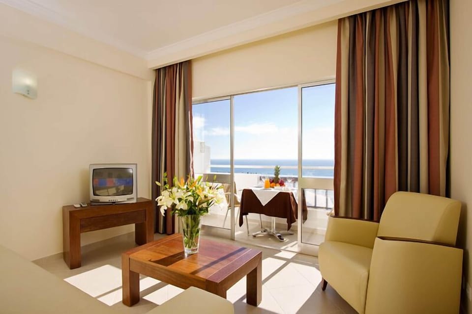 Apartment, 1 Bedroom | Living room | Flat-screen TV