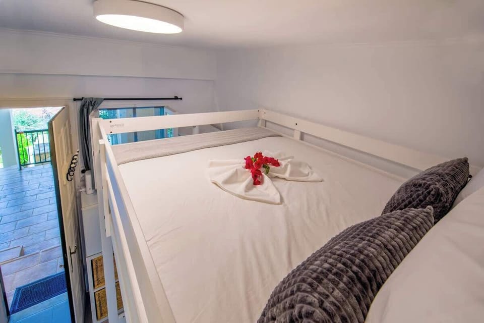 Comfortable Sleeping Area with Bunk Bed and Soft Lighting