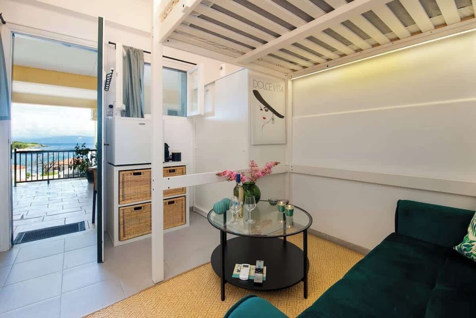 Bright Living Room with Sofa, Dining Table, and Open-Plan Layout