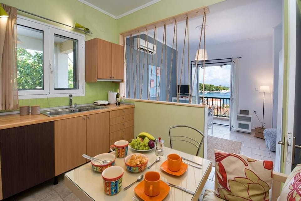 Fully Equipped Kitchenette with Dining Area and Garden Views