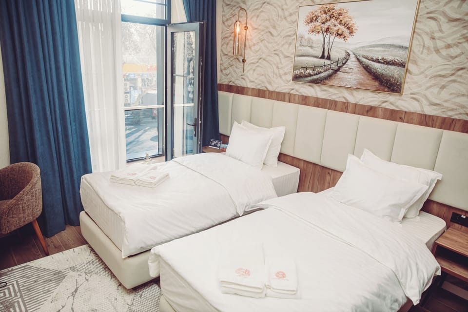 Deluxe Room, Balcony, City View | In-room safe, desk, laptop workspace, blackout drapes