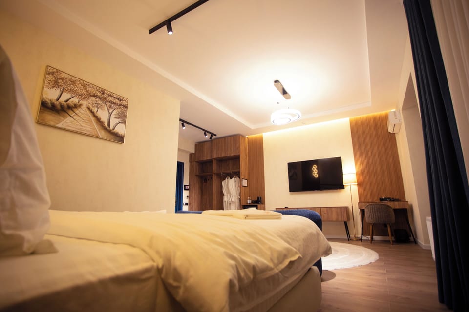 Luxury Room, Balcony, City View | In-room safe, desk, laptop workspace, blackout drapes