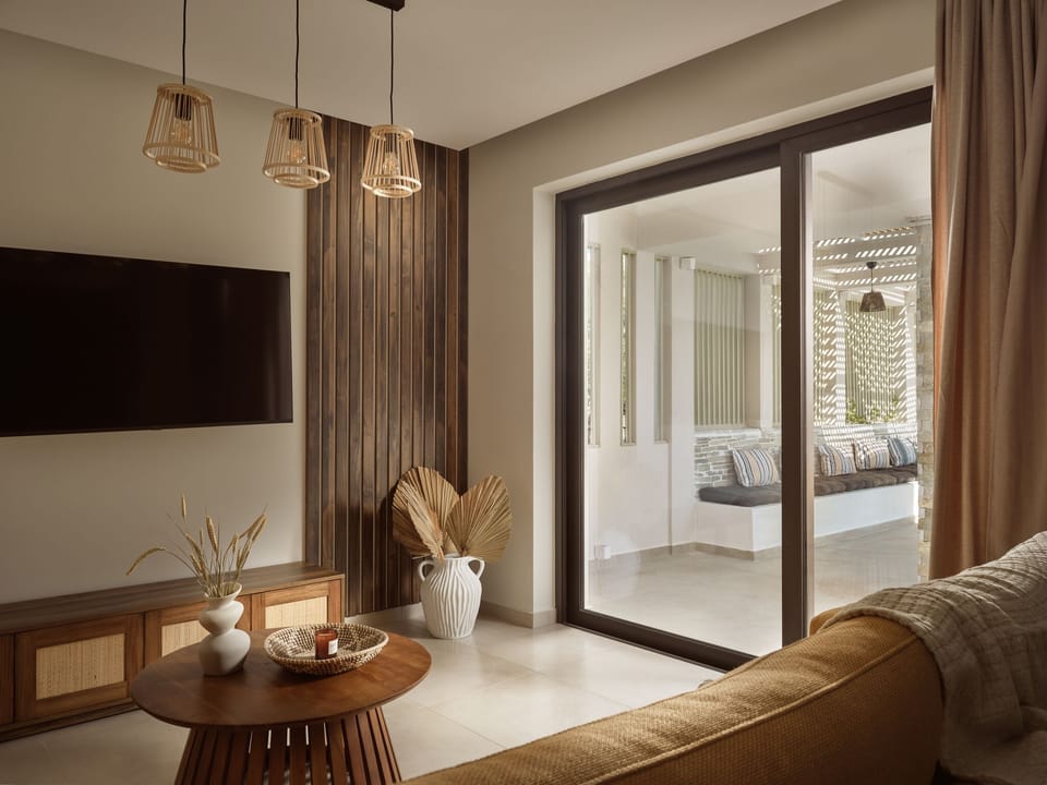 Open-plan lounge connects effortlessly to kitchen and pool terrace outside.
