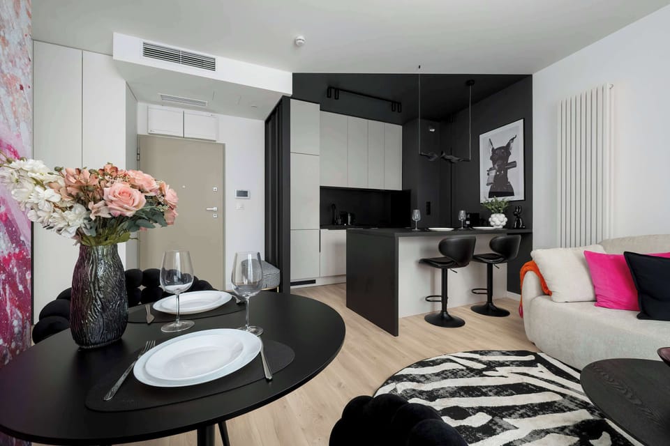 Enjoy your favorite shows on the flat-screen television in the elegant living area.