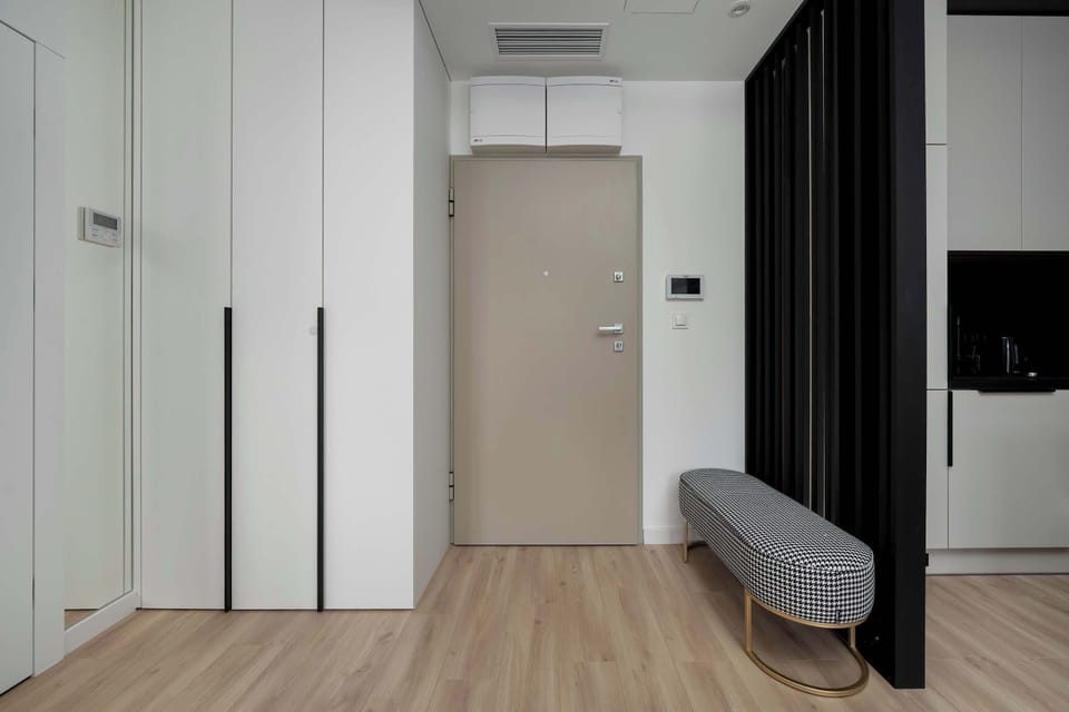 The living room's sleek design is both functional and aesthetically pleasing.