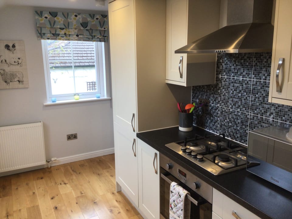 Kitchen inc Fridge Freezer, Microwave, Oven and 4 burner hob