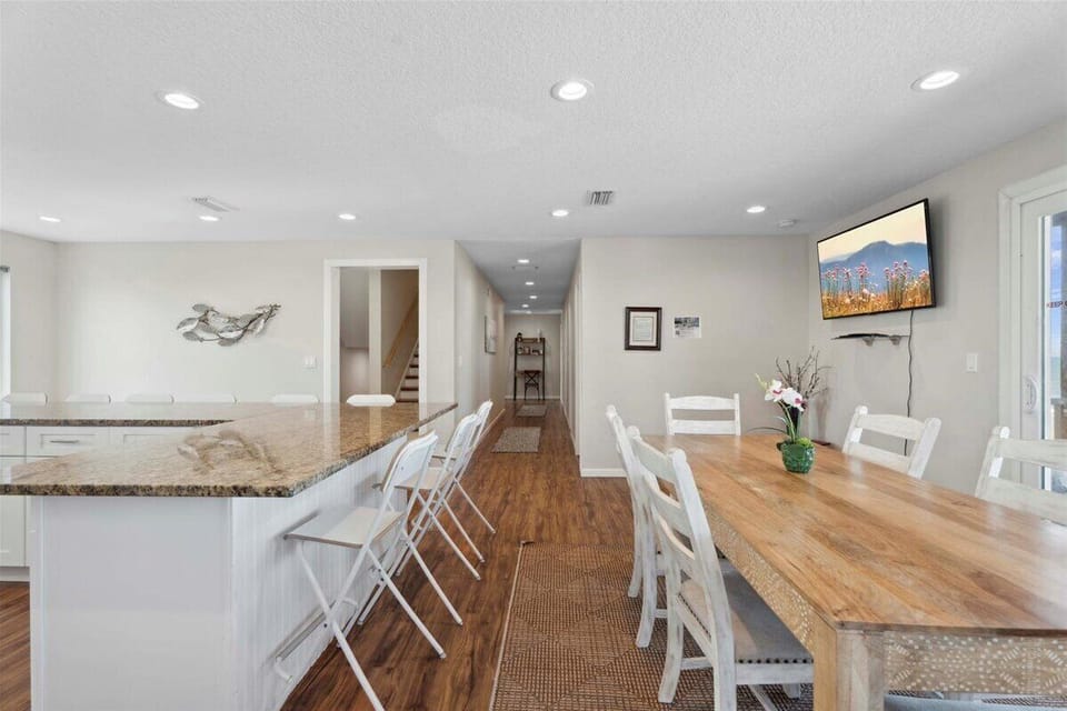 Oceanfront kitchen with island seating and panoramic beach views. 🌊🍽️