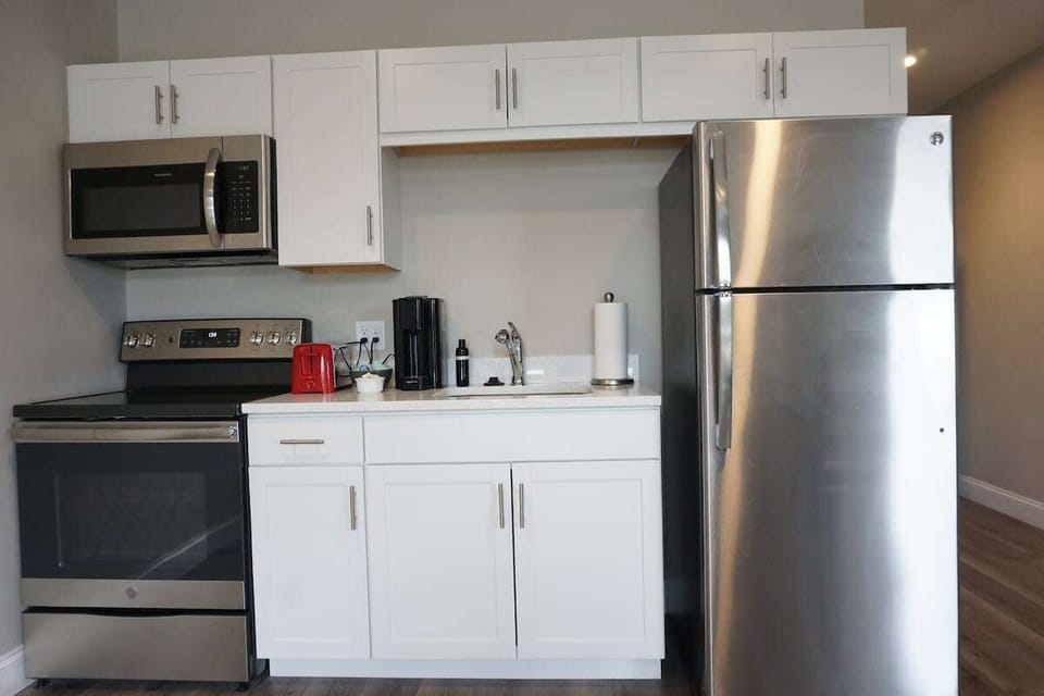 Fully-stocked kitchen with brand-new stainless steel appliances.