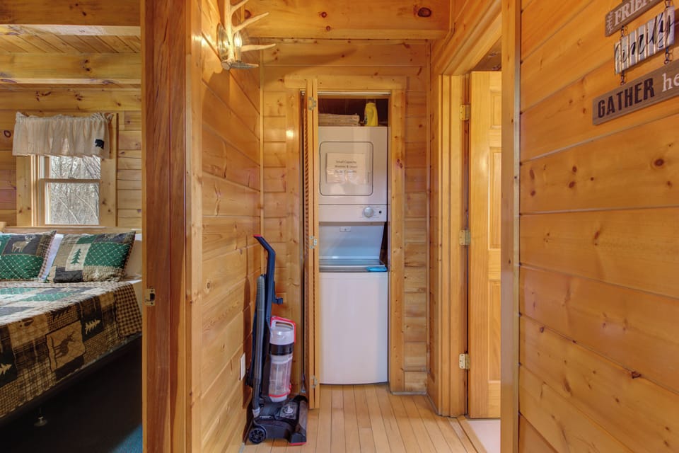 Your cozy cabin features a convenient stacked washer and dryer, making longer stays effortless with fresh linens always ready.
