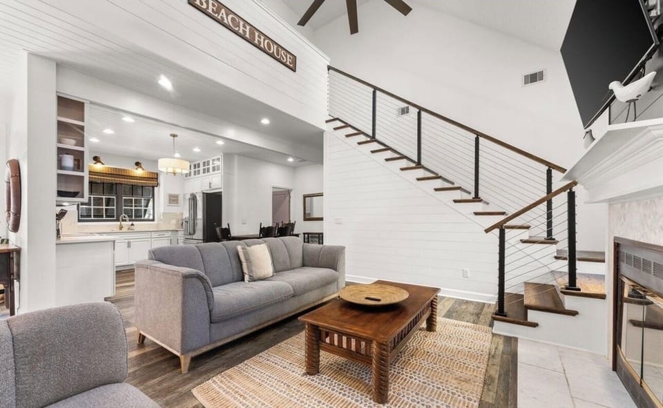 Living area; stairs to 4th bedroom