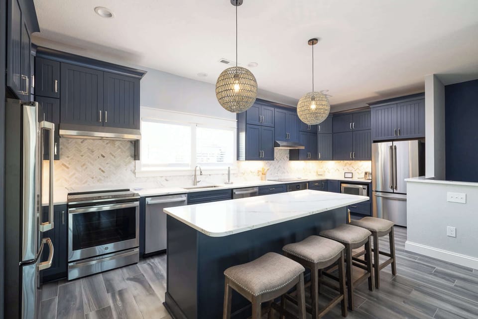 Fully Equipped Kitchen w/ Breakfast bar seating, Full Size Bonus Fridge, Dish Washer, Sink, and cooking utensils