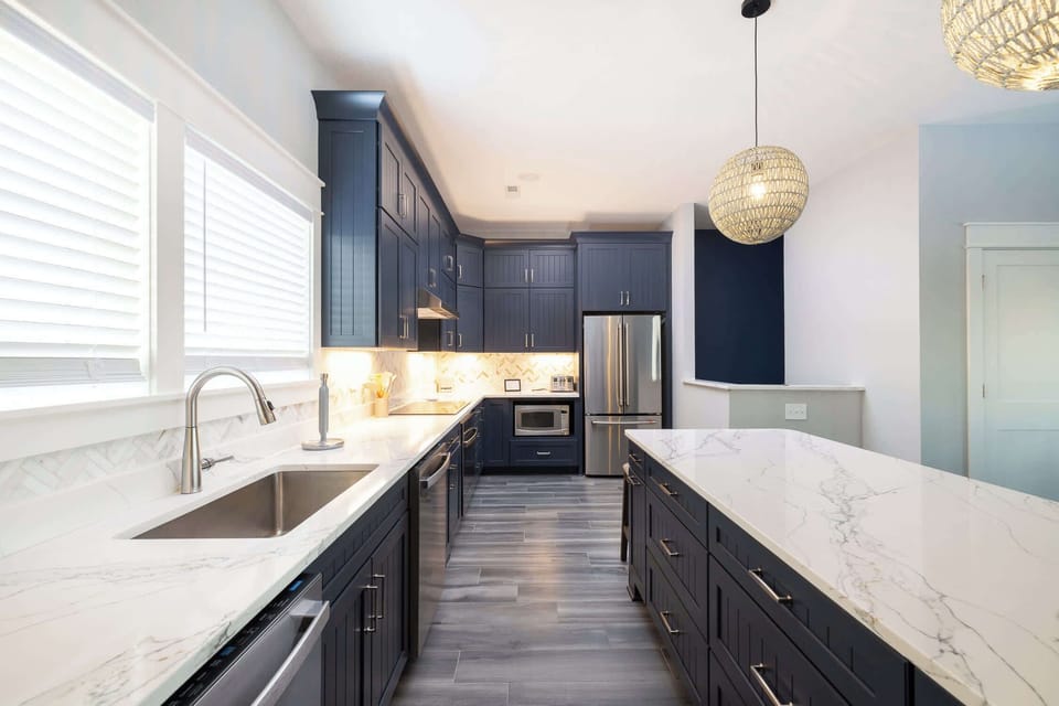 Fully Equipped Kitchen w/ Breakfast bar seating, Full Size Bonus Fridge, Dish Washer, Sink, and cooking utensils