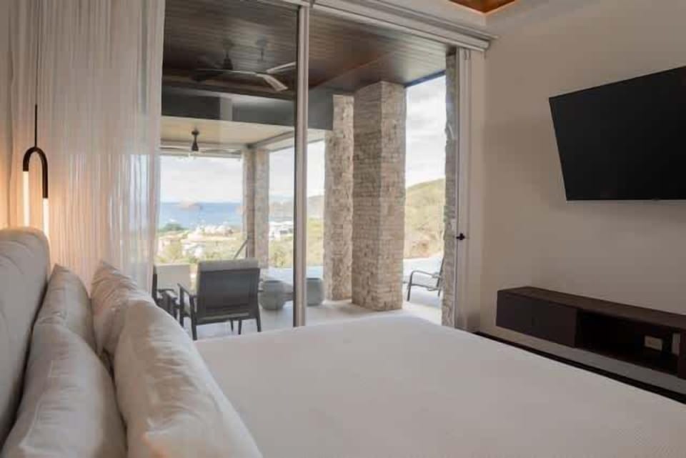 Spacious king bedroom with private balcony and ensuite bathroom