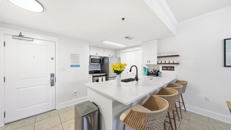 The kitchen bar becomes the perfect spot to plan another day in paradise