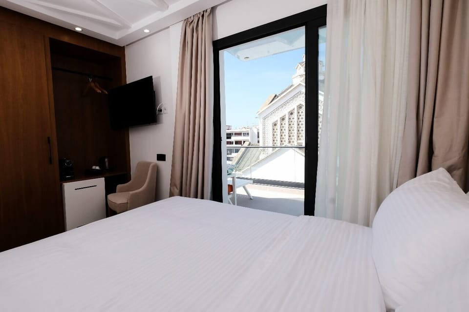 Deluxe Double Room, City View | Minibar, in-room safe, iron/ironing board, free cribs/infant beds