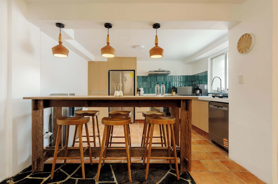 Kitchen equipped with breakfast bar