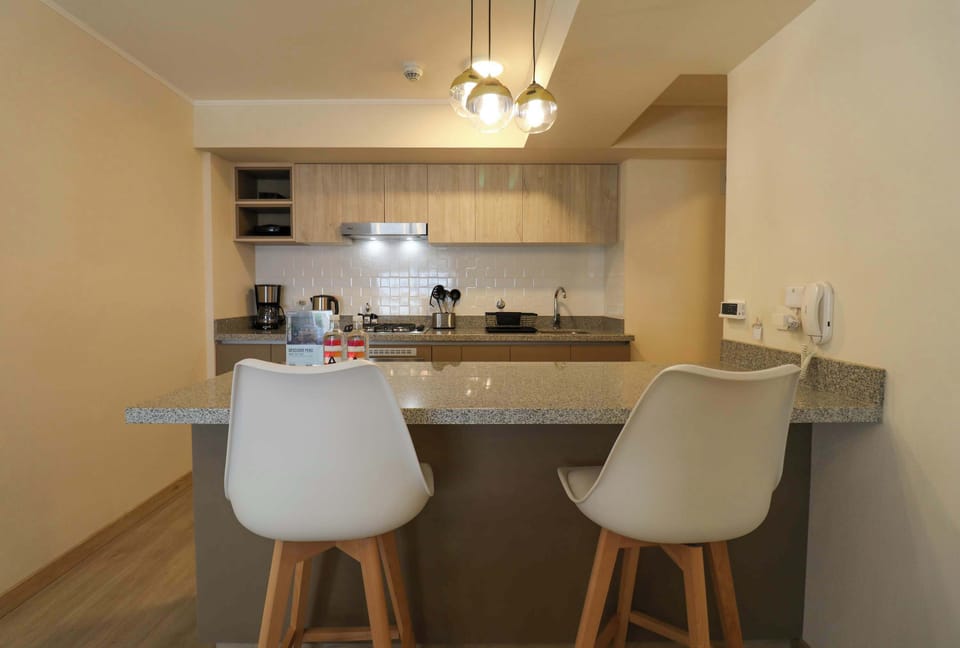 Kitchen equipped with dining bar