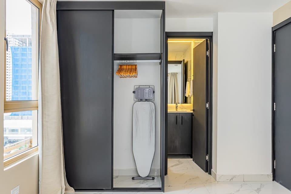 Modern wardrobe with iron and bathroom