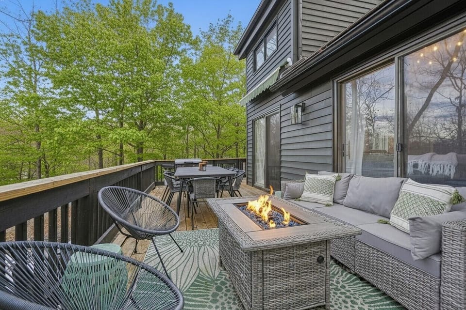 Enjoy a cozy propane firepit on the treetop deck with gas grill and table for 8.