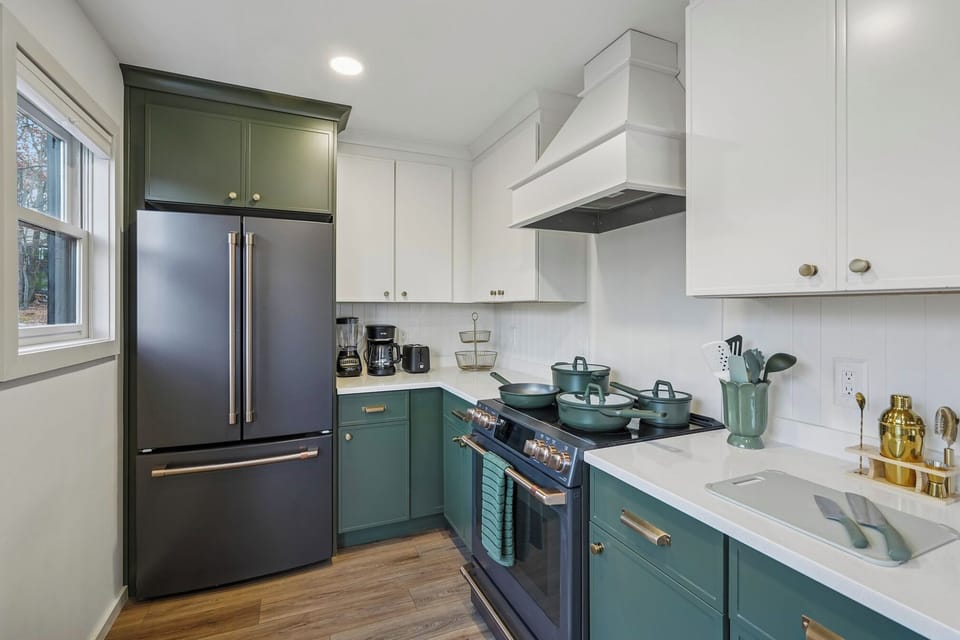 This designer kitchen features GE Café appliances including electric range/oven.