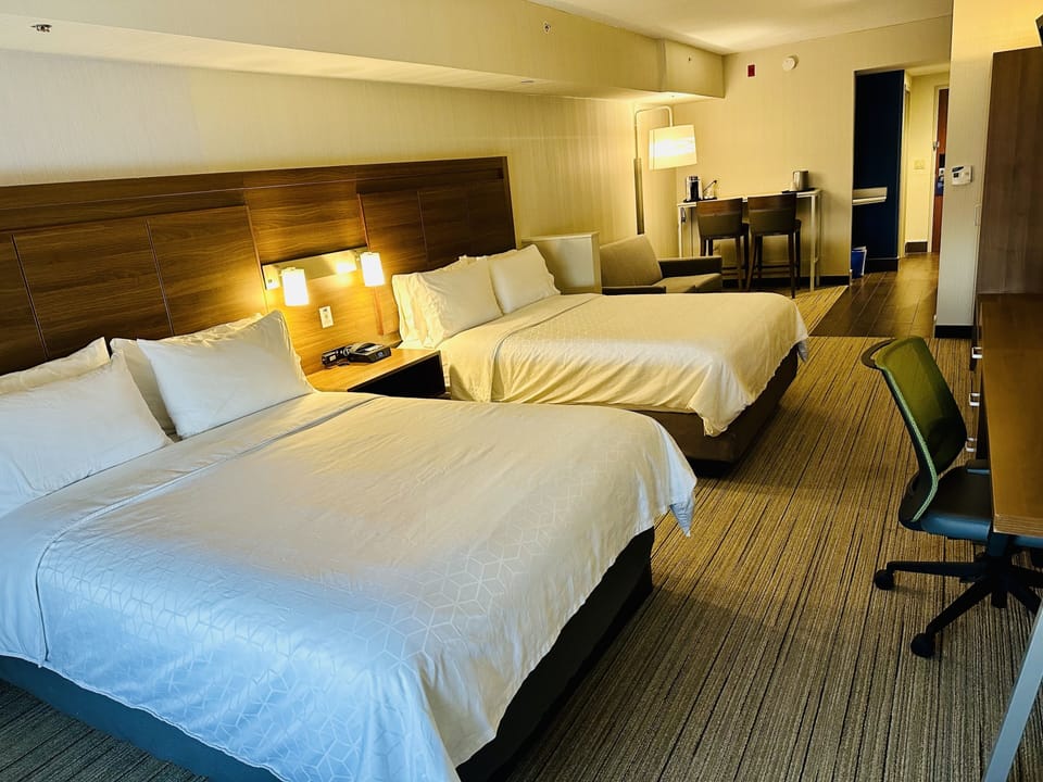 Suite, Multiple Beds | Desk, laptop workspace, blackout drapes, iron/ironing board
