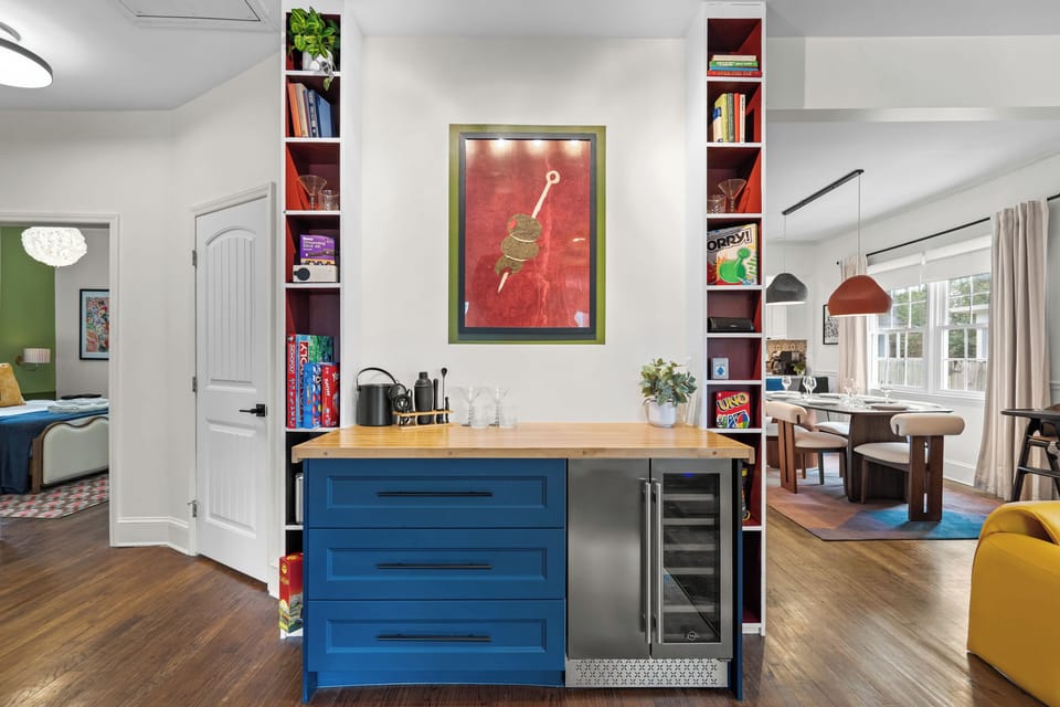 Beverage area with shelf of books and board games